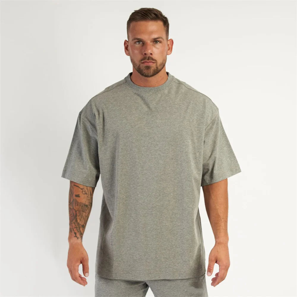 New Casual Loose T-shirt Men Cotton Short Sleeves Tees Tops Summer Gym Fitness Solid Shirt Male Running Sports Training Clothing